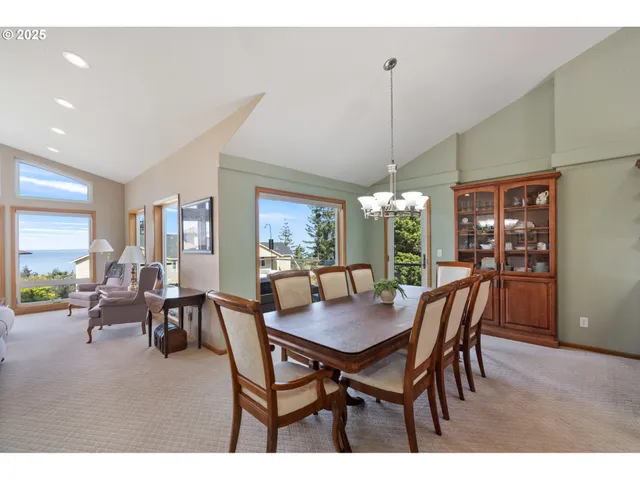 a view of a dining room with furniture and window