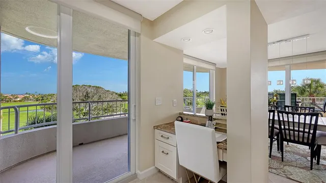 a view of a living room and a balcony