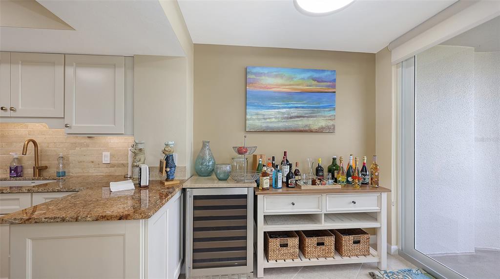 775 Longboat Club Road, Unit 304 Longboat Key, FL 34228 - Photo 13 of 52 a kitchen with stainless steel appliances a sink and cabinets
