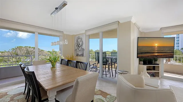 a view of a dining room with furniture window and outside view