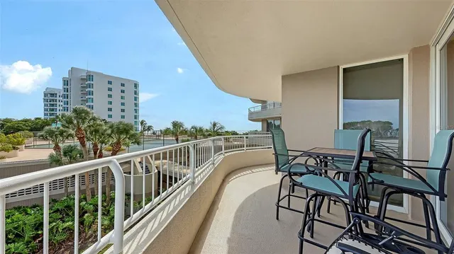 a view of a balcony with chairs