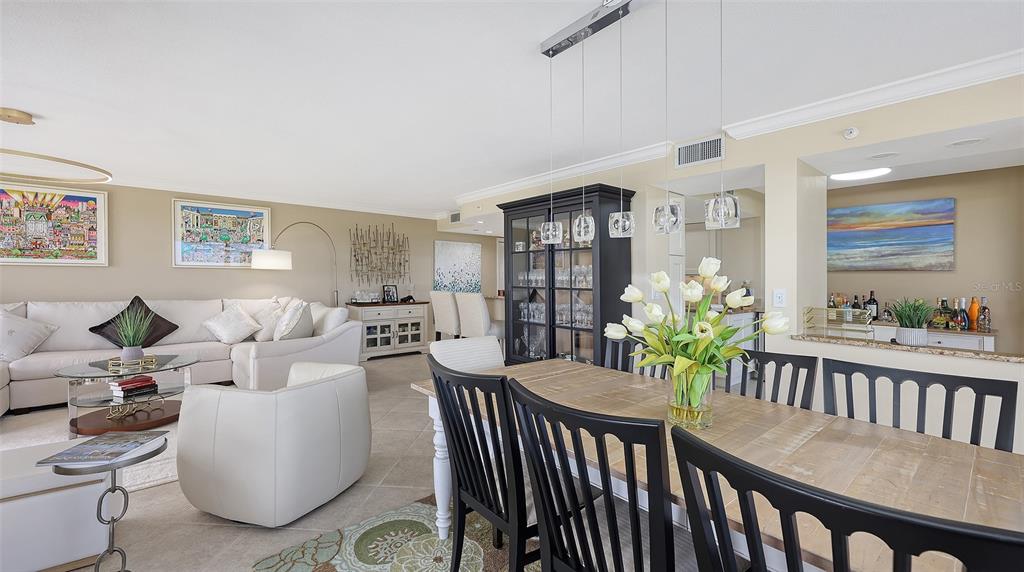775 Longboat Club Road, Unit 304 Longboat Key, FL 34228 - Photo 19 of 52 a living room with furniture and wooden floor