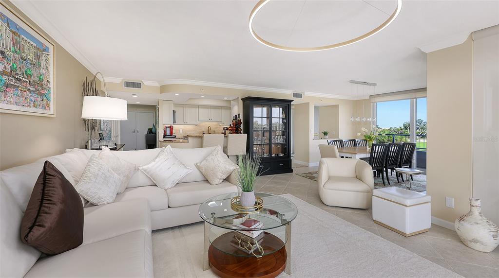 775 Longboat Club Road, Unit 304 Longboat Key, FL 34228 - Photo 24 of 52 a living room with furniture and a potted plant
