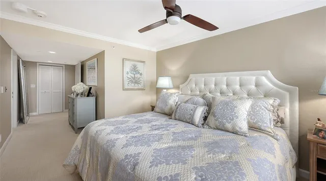 a bedroom with a bed and flat screen tv