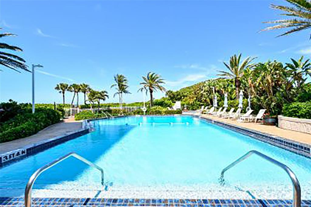 775 Longboat Club Road, Unit 304 Longboat Key, FL 34228 - Photo 37 of 52 a view of swimming pool with a garden and outdoor seating