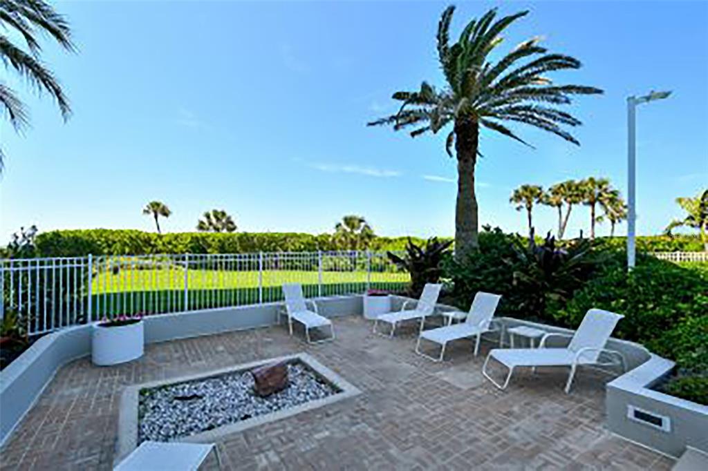 775 Longboat Club Road, Unit 304 Longboat Key, FL 34228 - Photo 38 of 52 a view of a table and chairs in patio