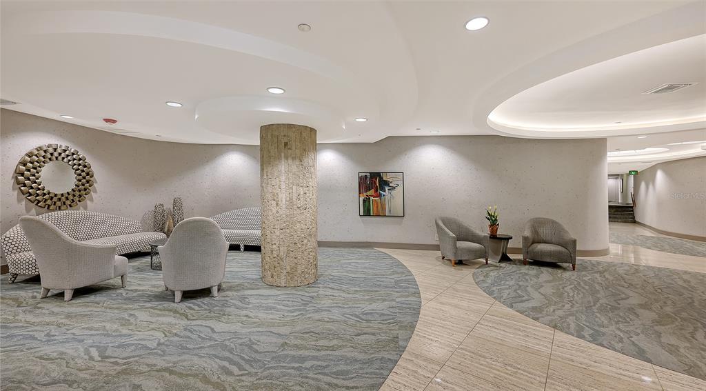 775 Longboat Club Road, Unit 304 Longboat Key, FL 34228 - Photo 5 of 52 a living room with furniture