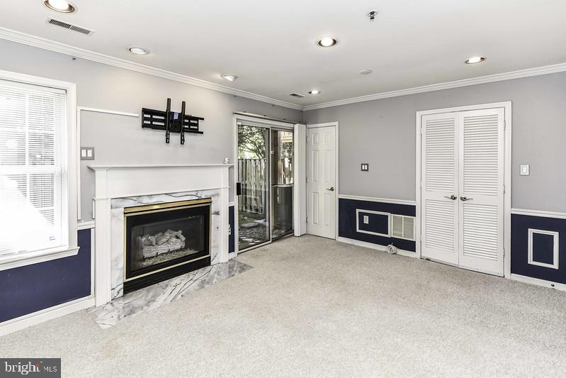2 Parker Farm Court Silver Spring, MD 20906 - Photo 7 of 34 a view of a livingroom with a fireplace cabinet and windows