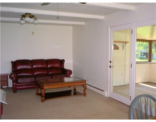 892 Manchester Road Belgrade, ME 04917 - Photo 17 of 22 Living Room. to enclosed porch...