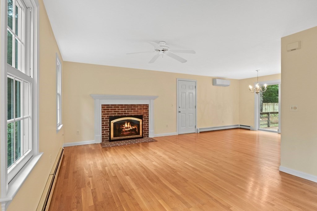50 Nye Road Barnstable, MA 02632 - Photo 3 of 13 a view of empty room with a fireplace and wooden floor