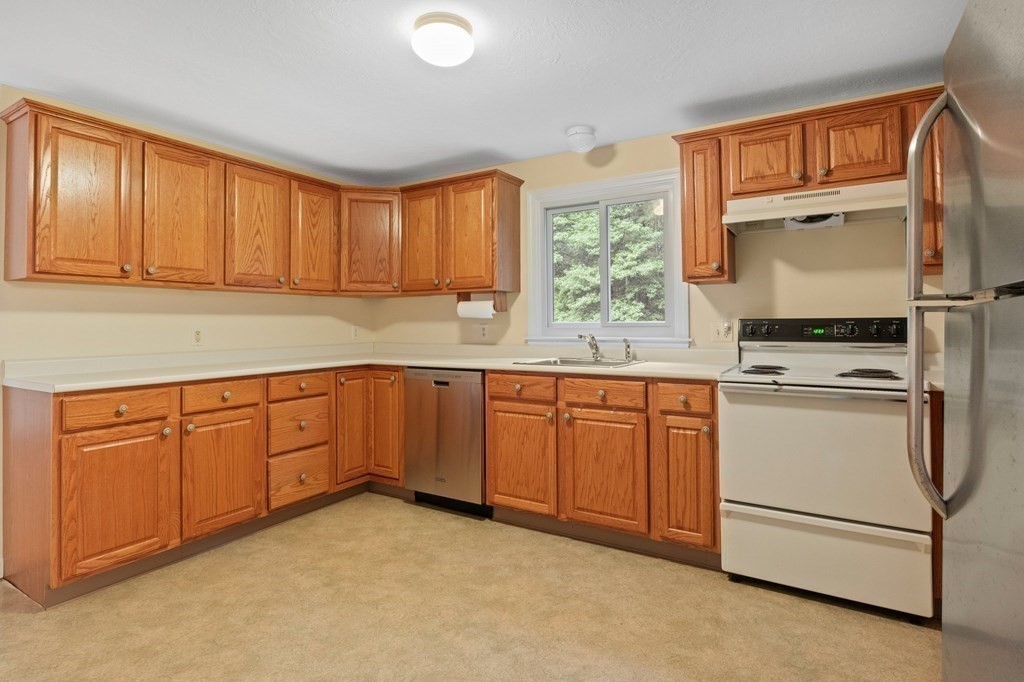 50 Nye Road Barnstable, MA 02632 - Photo 7 of 13 a kitchen with granite countertop cabinets stainless steel appliances and a window