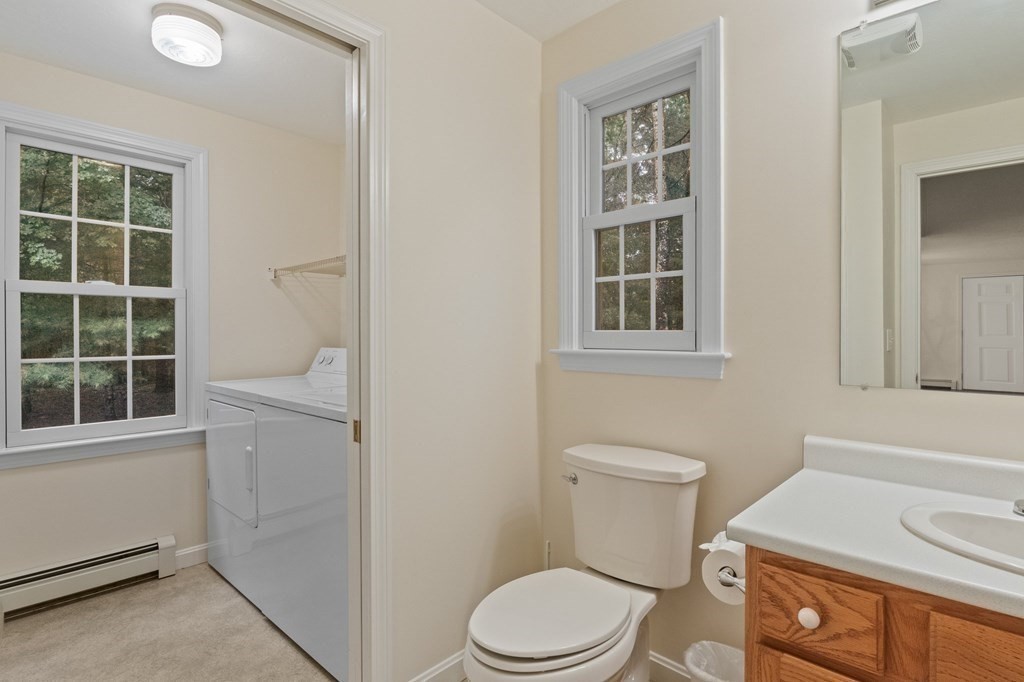 50 Nye Road Barnstable, MA 02632 - Photo 8 of 13 a white toilet sitting next to a bathroom sink