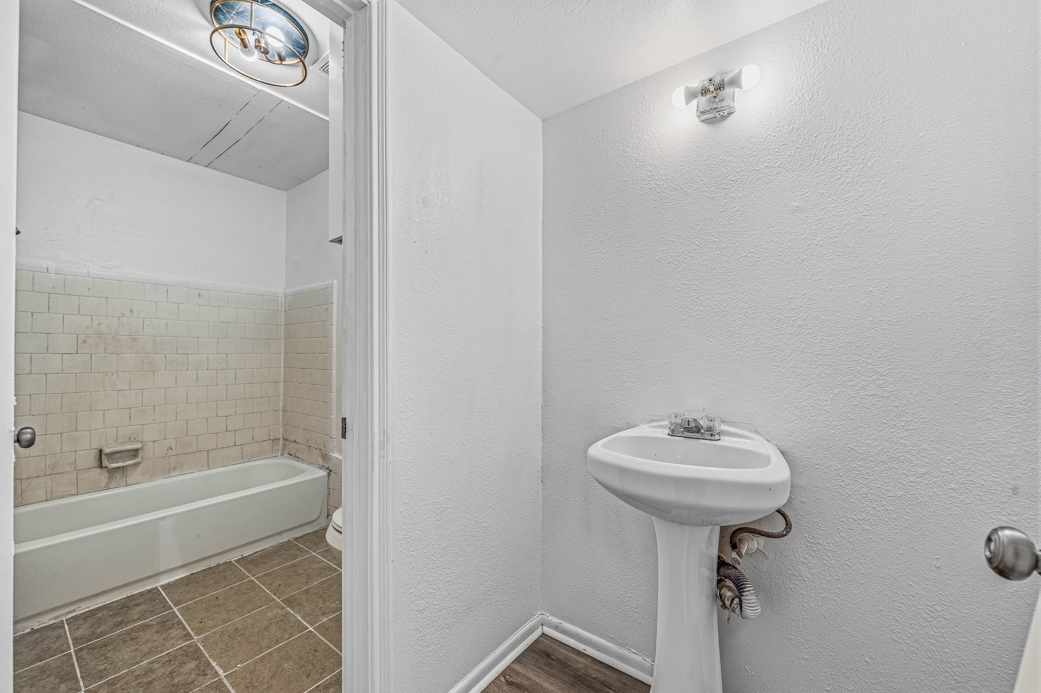 12054 Beechnut Street Houston, TX 77072 - Photo 11 of 21 a bathroom with a sink toilet and shower