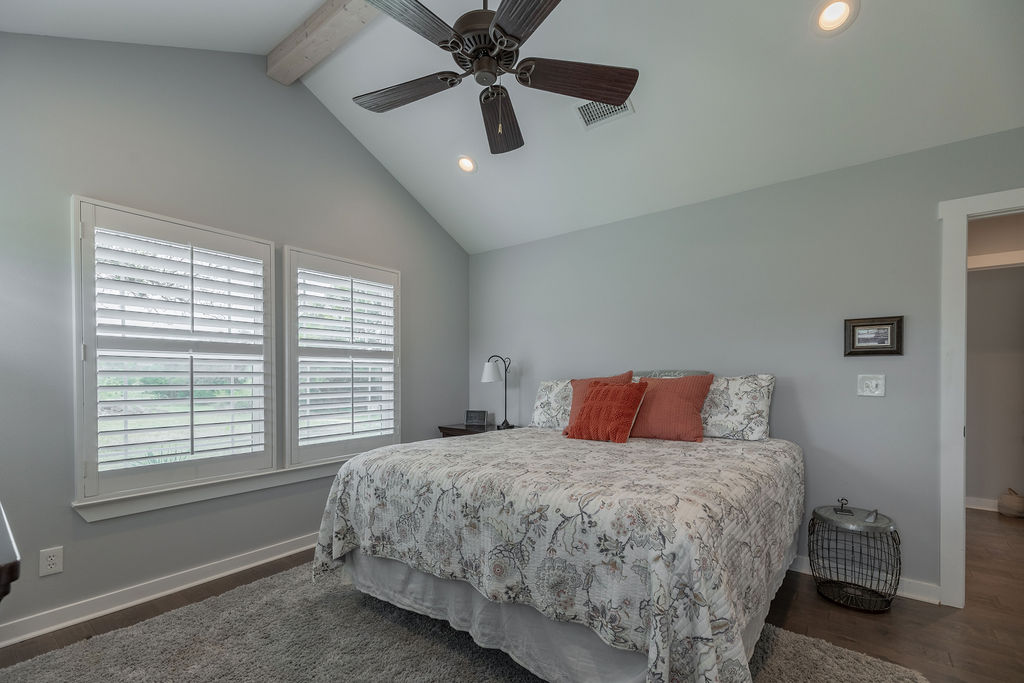 579 Triples Trail Johnson City, TX 78636 - Photo 16 of 39 a bedroom with a large bed and a window