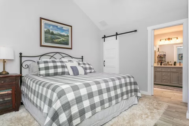 579 Triples Trail Johnson City, TX 78636 - Photo 34 of 39 a bedroom with a bed and a cabinets