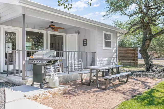 579 Triples Trail Johnson City, TX 78636 - Photo 36 of 39 a front view of a house with patio chairs and wooden fence