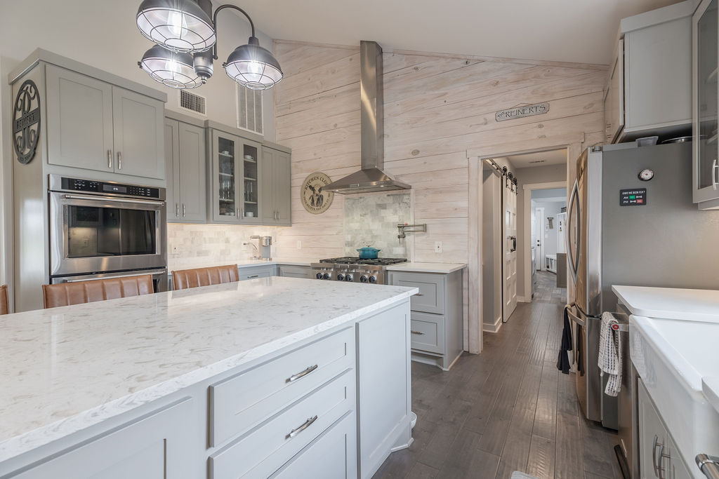579 Triples Trail Johnson City, TX 78636 - Photo 7 of 39 a kitchen with a sink stainless steel appliances and chandelier