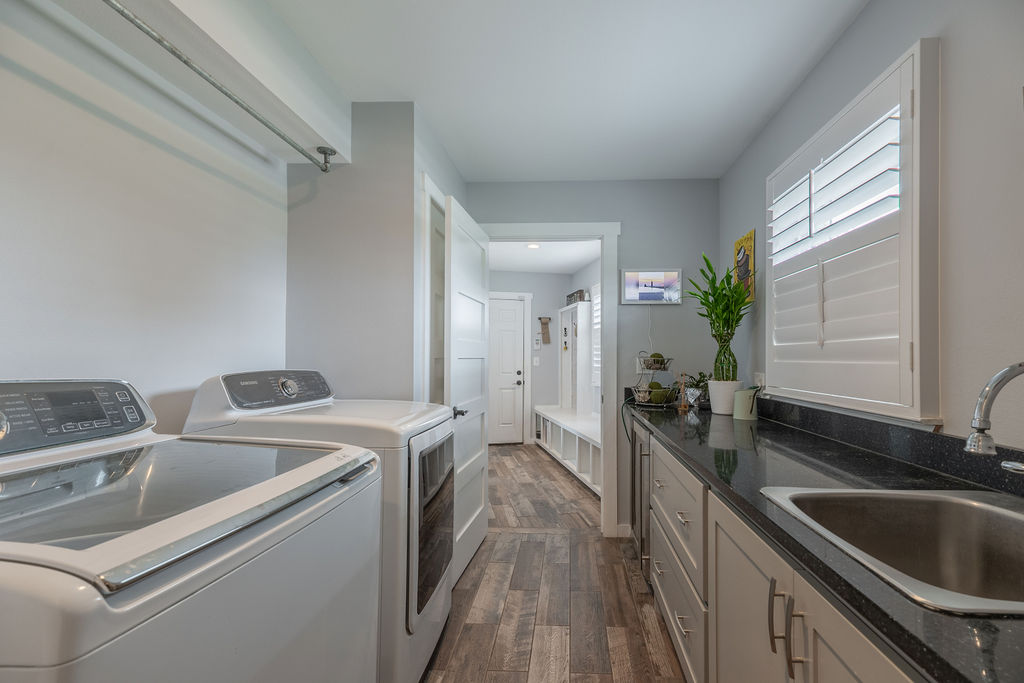 579 Triples Trail Johnson City, TX 78636 - Photo 8 of 39 a view of a kitchen with a sink appliances and cabinets