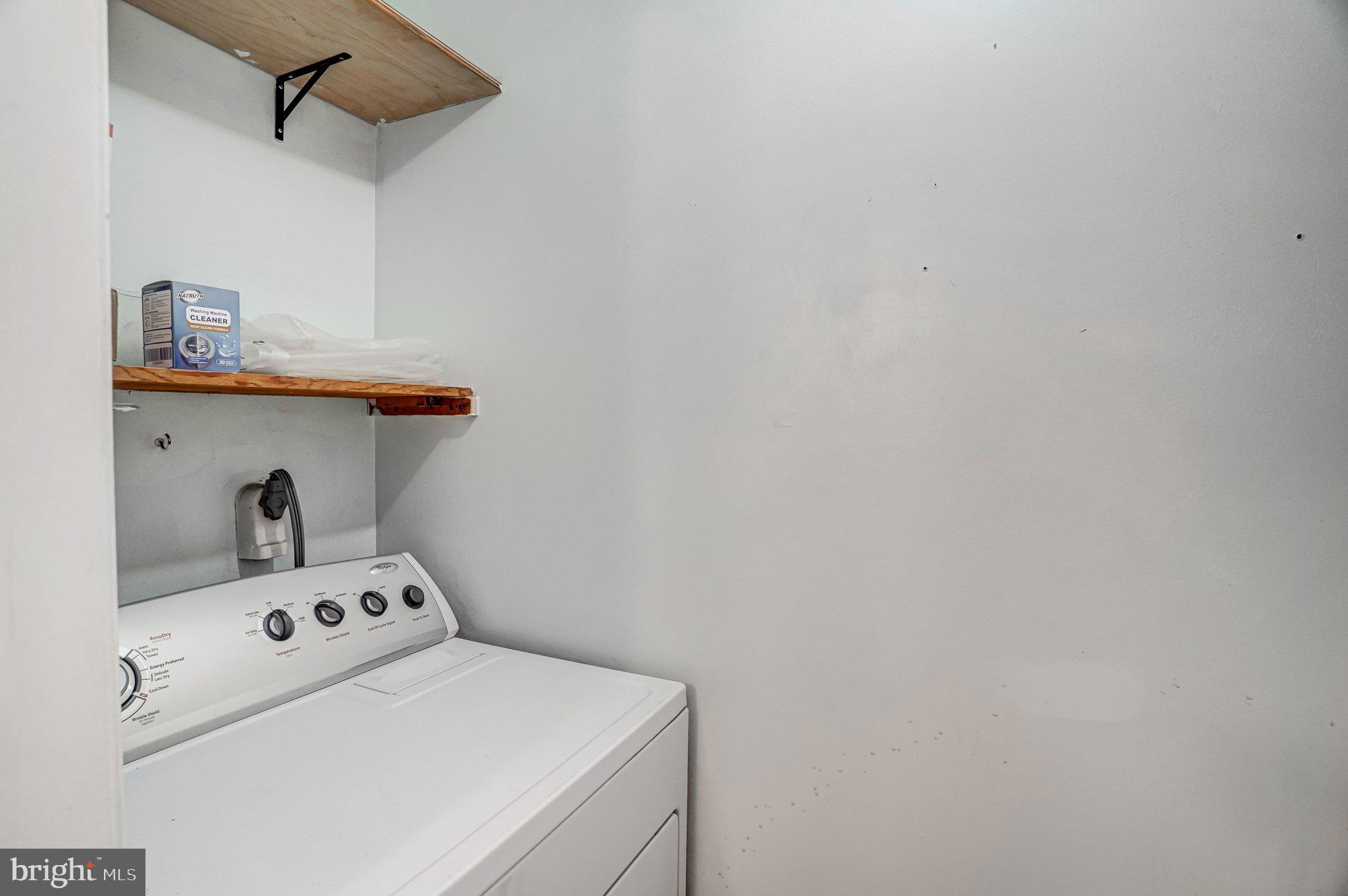 8396 Forrester Boulevard, Unit 555 Springfield, VA 22152 - Photo 19 of 24 a utility room with dryer and washer