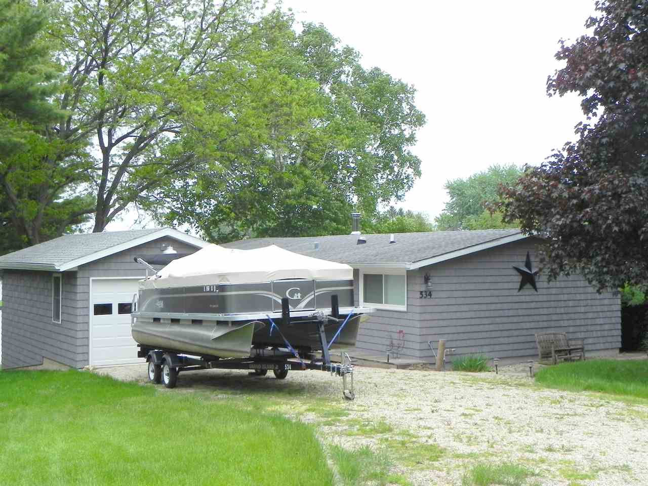 534 Baintree Road Lake Summerset, IL 61019 - Photo 1 of 25 a view of a house with backyard and sitting area