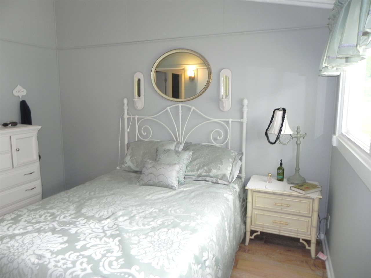 534 Baintree Road Lake Summerset, IL 61019 - Photo 21 of 25 a bedroom with a bed and a mirror
