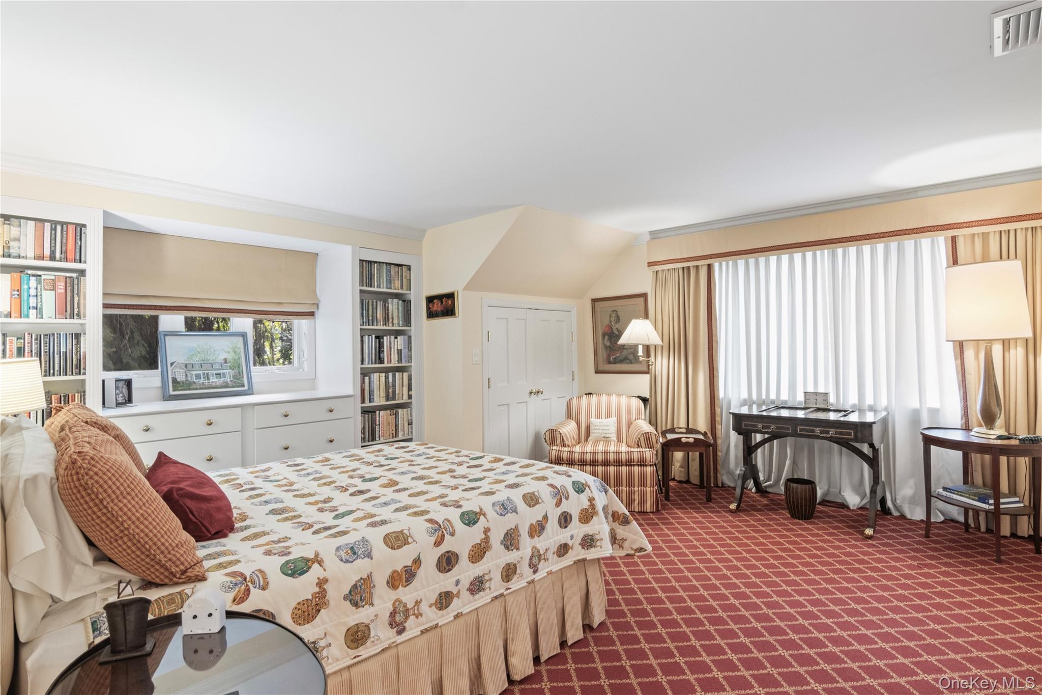 1276 Ridge Road Syosset, NY 11791 - Photo 16 of 30 a spacious bedroom with a bed and large windows