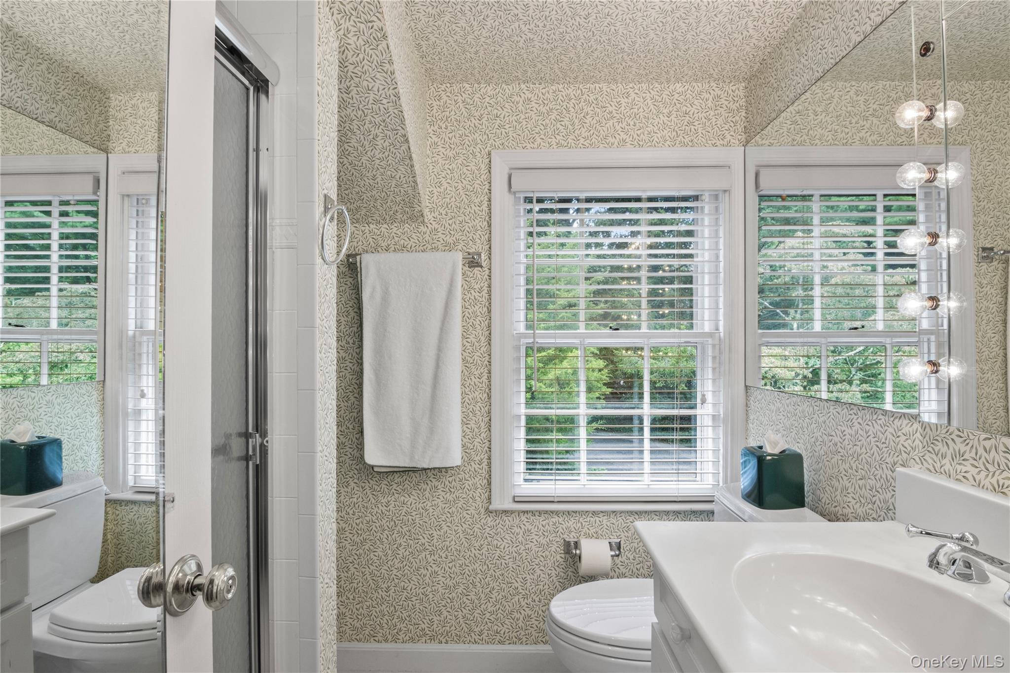 1276 Ridge Road Syosset, NY 11791 - Photo 19 of 30 a bathroom with a sink toilet and shower