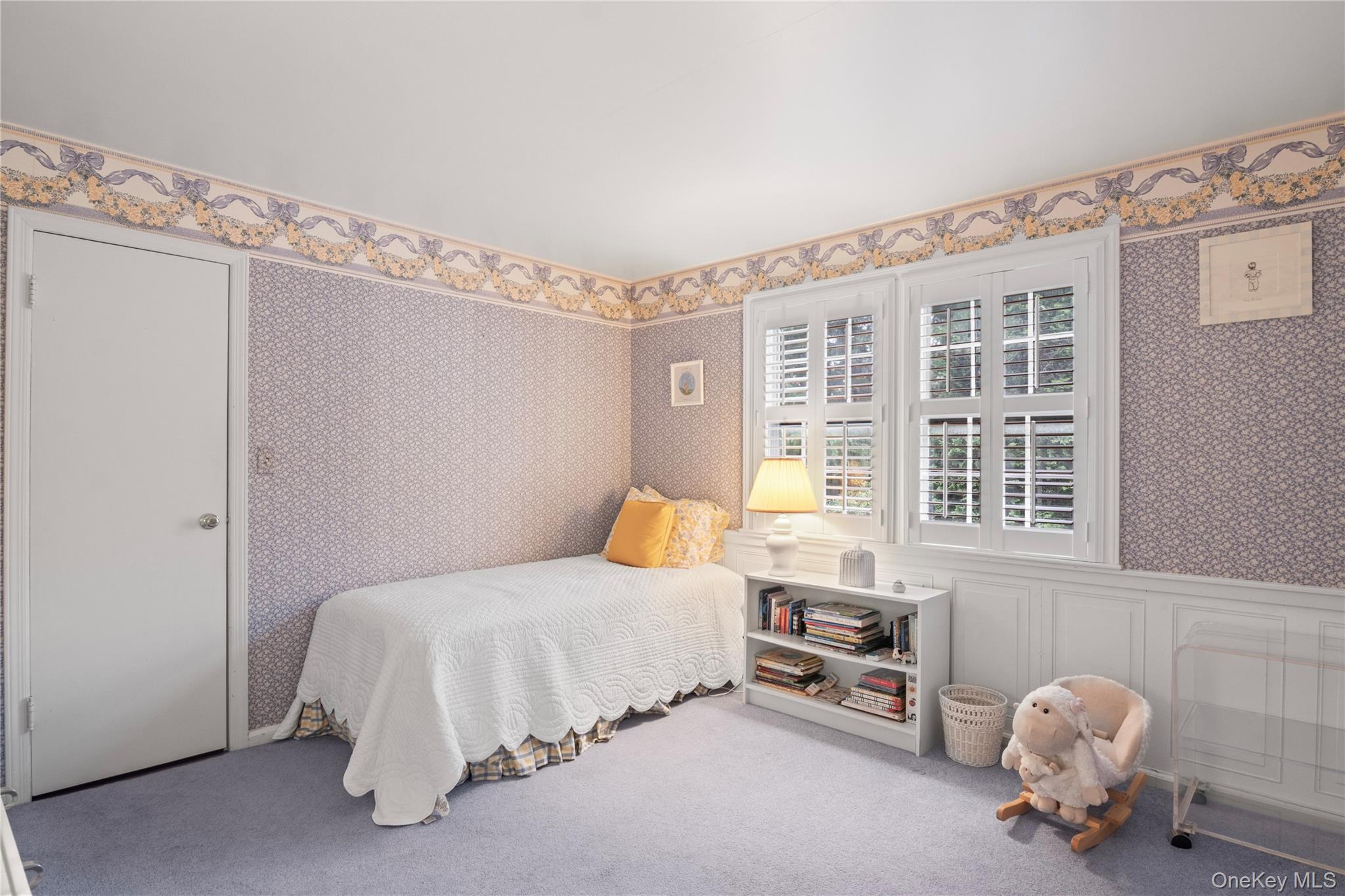 1276 Ridge Road Syosset, NY 11791 - Photo 21 of 30 a bedroom with a bed and a window