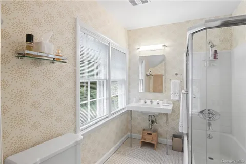 a bathroom with a bathtub and a shower