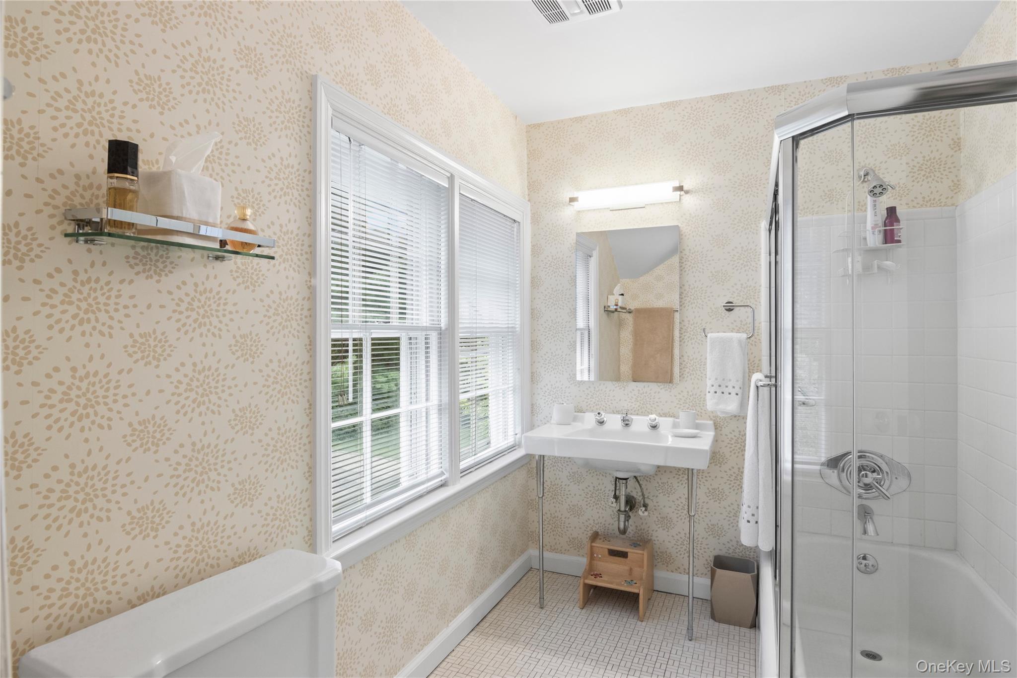 1276 Ridge Road Syosset, NY 11791 - Photo 22 of 30 a bathroom with a bathtub and a shower