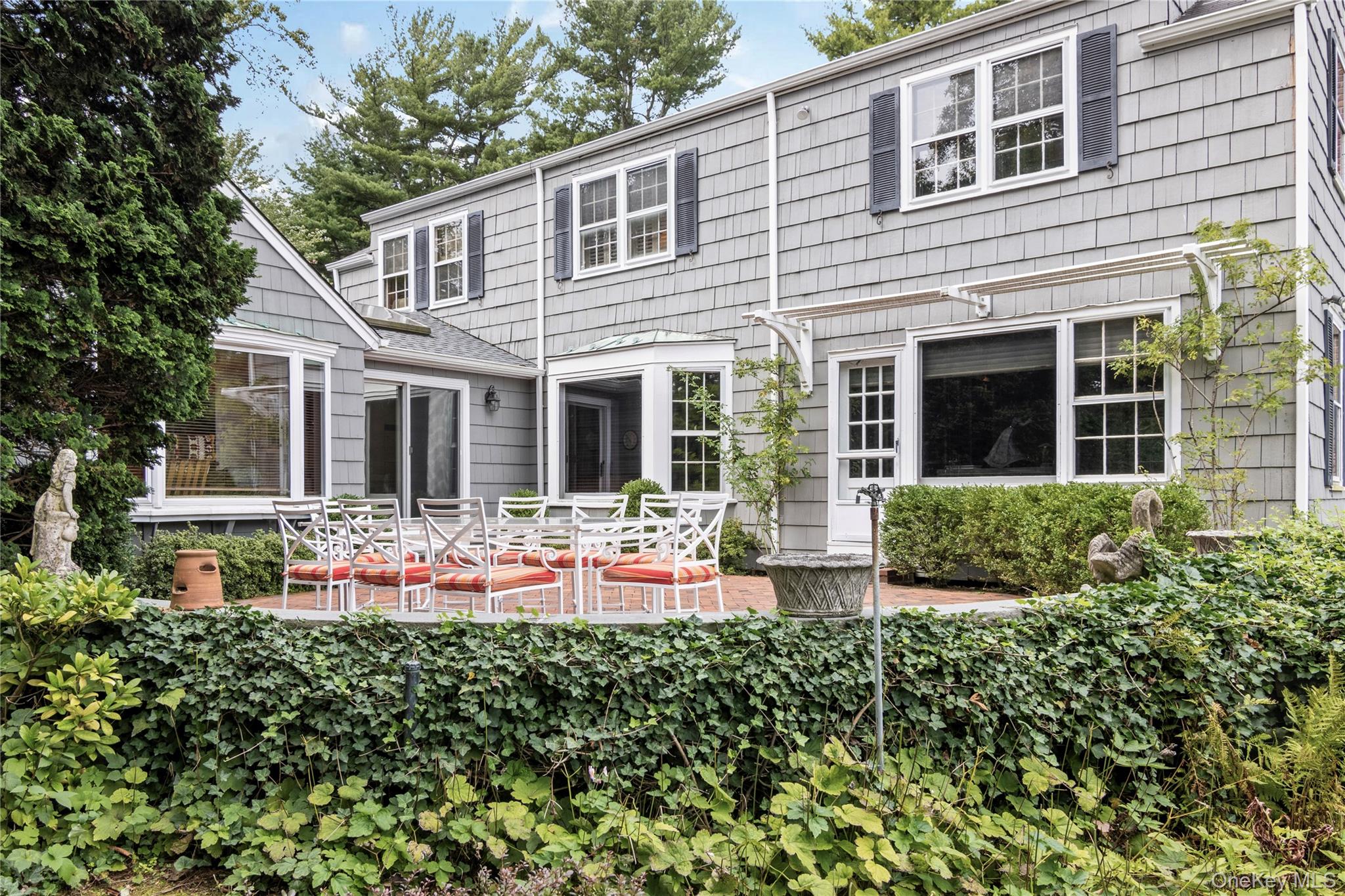 1276 Ridge Road Syosset, NY 11791 - Photo 24 of 30 front view of a house with a yard