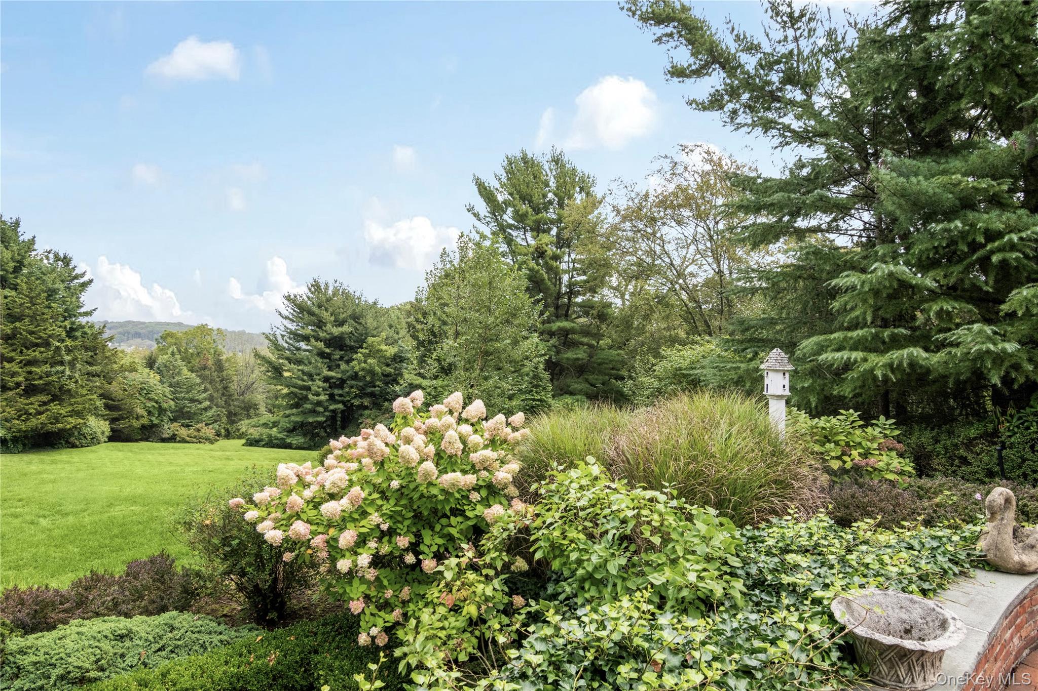 1276 Ridge Road Syosset, NY 11791 - Photo 25 of 30 a view of a lake with a yard