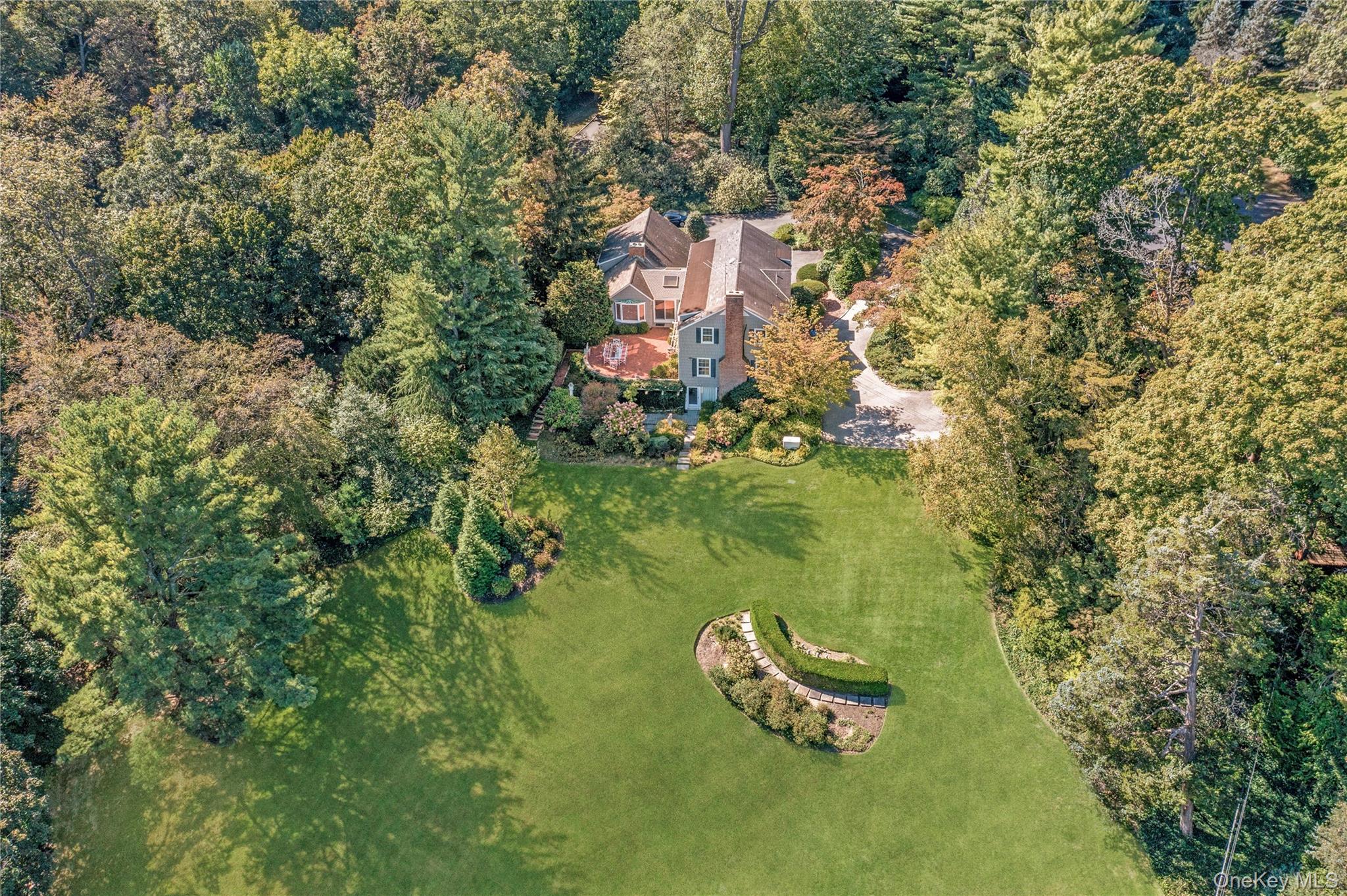 1276 Ridge Road Syosset, NY 11791 - Photo 29 of 30 an aerial view of a house with a yard