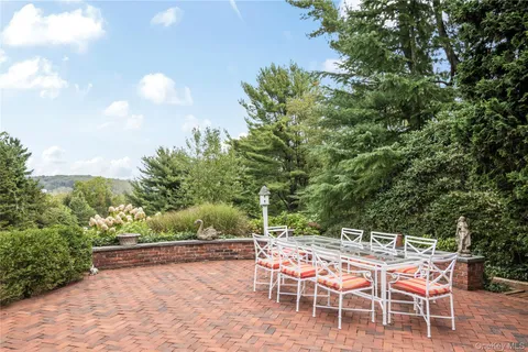 a view of a chairs and table in the patio