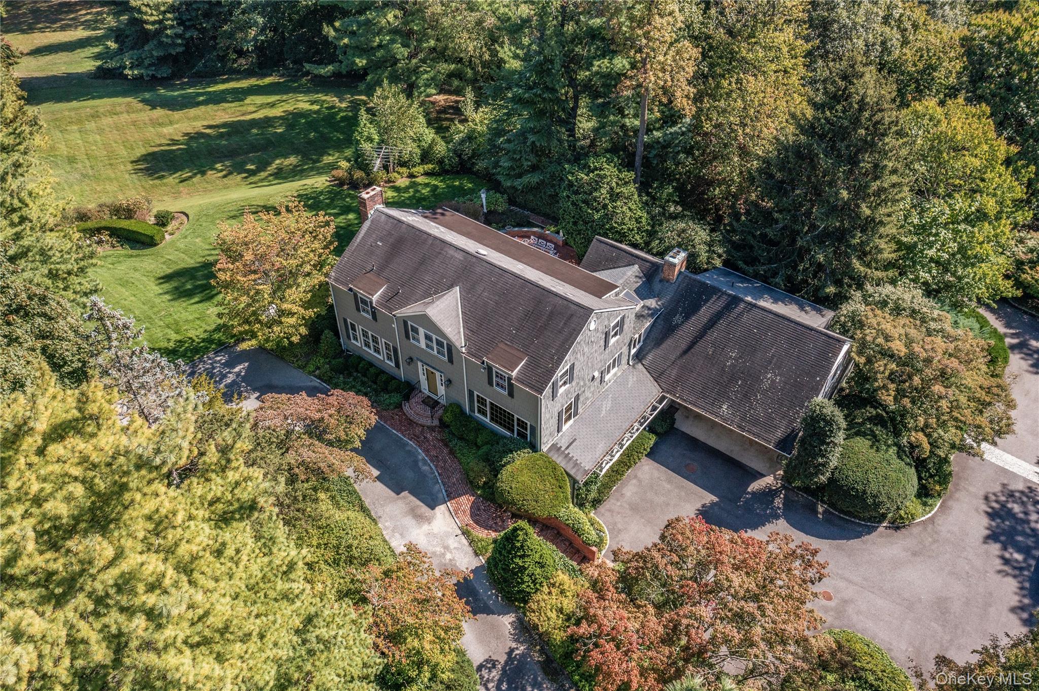 1276 Ridge Road Syosset, NY 11791 - Photo 4 of 30 a view of a house with a yard and large trees
