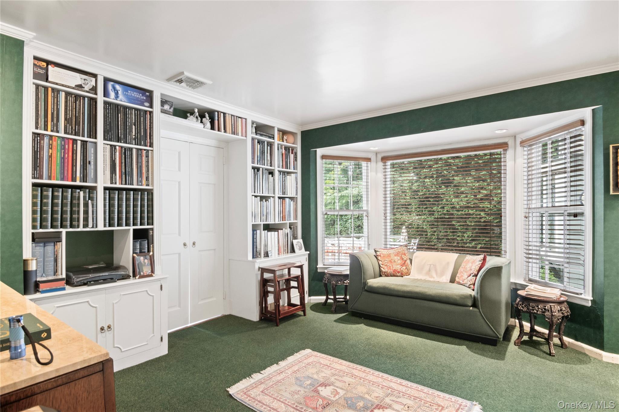 1276 Ridge Road Syosset, NY 11791 - Photo 9 of 30 a living room with furniture tv and a window