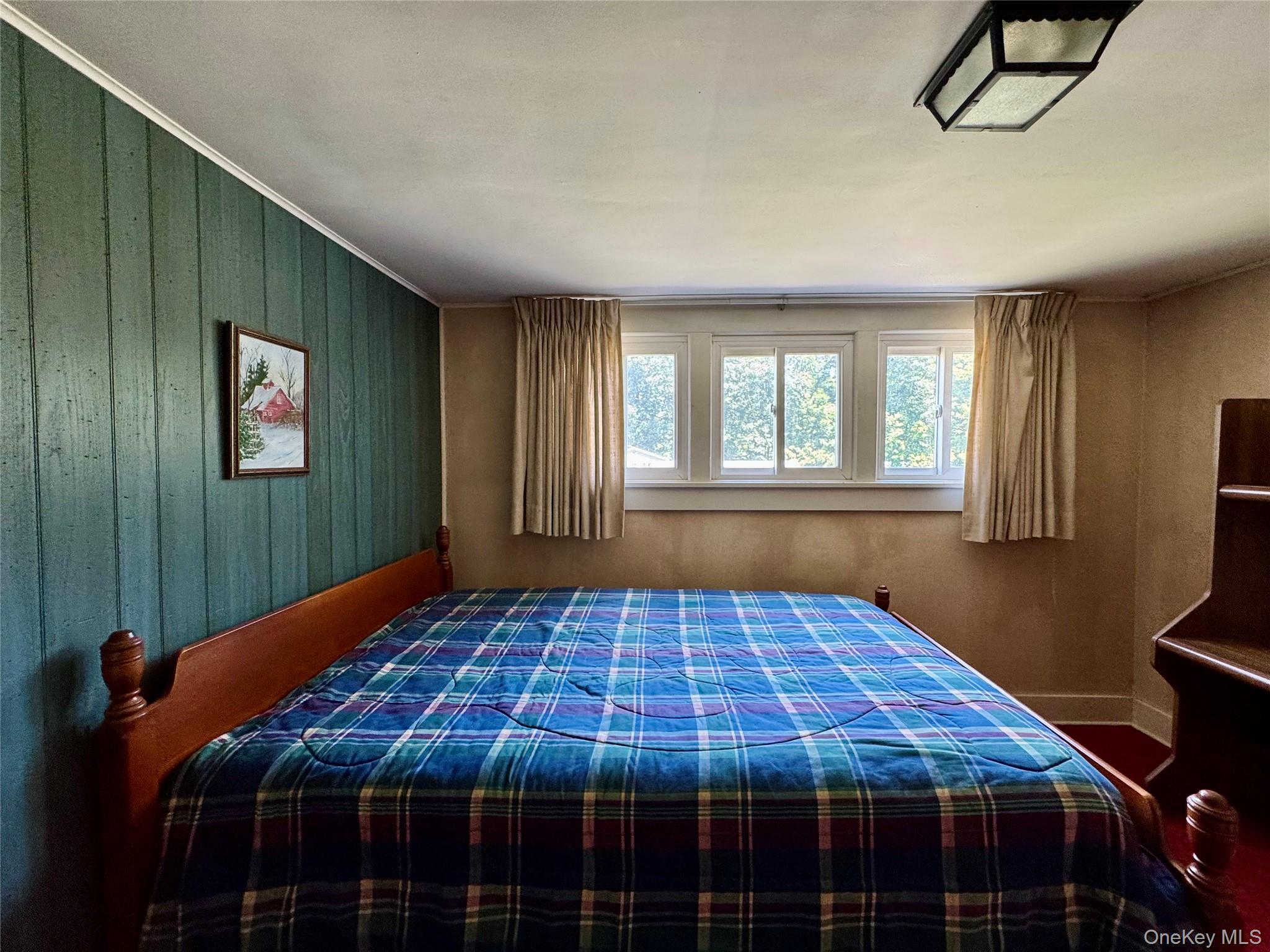 36 Jones Street Cairo, NY 12413 - Photo 23 of 32 a bed sitting in a bedroom next to a window
