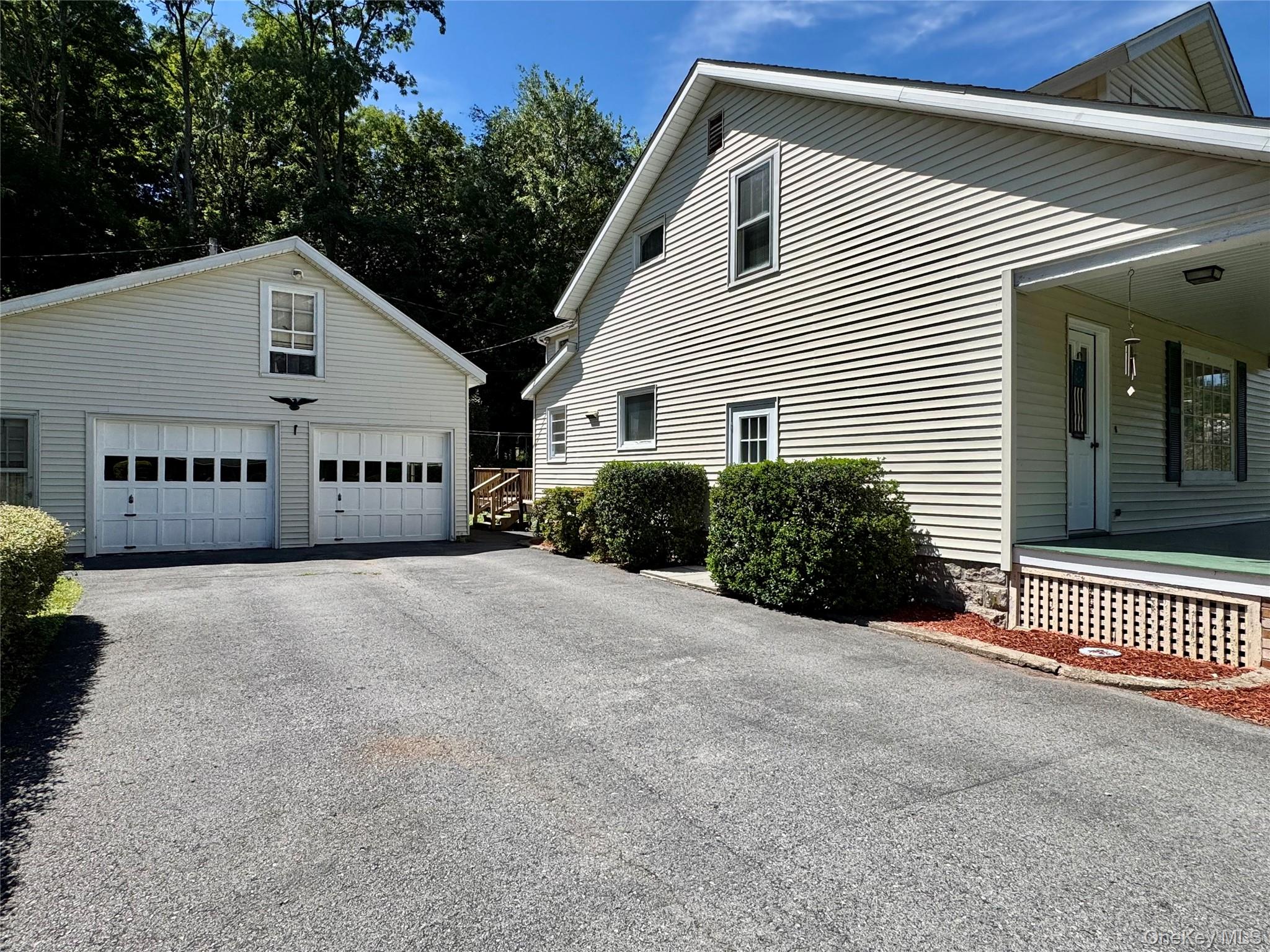 36 Jones Street Cairo, NY 12413 - Photo 27 of 32 a view of a house with a yard and garage