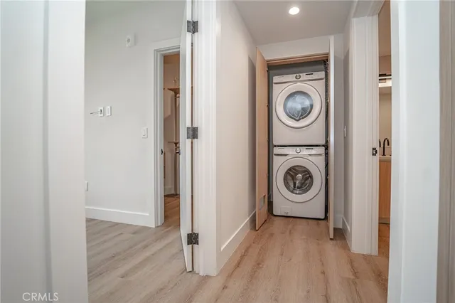 a view of washer and dryer with wooden floor