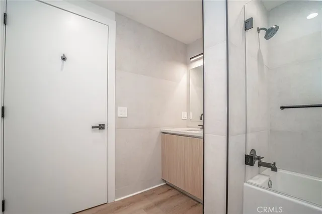 a bathroom with a bathtub and shower