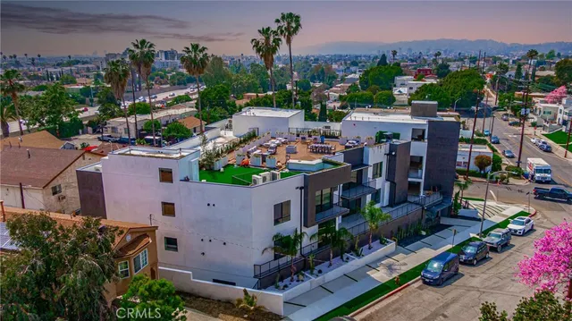 an aerial view of a house with a garden