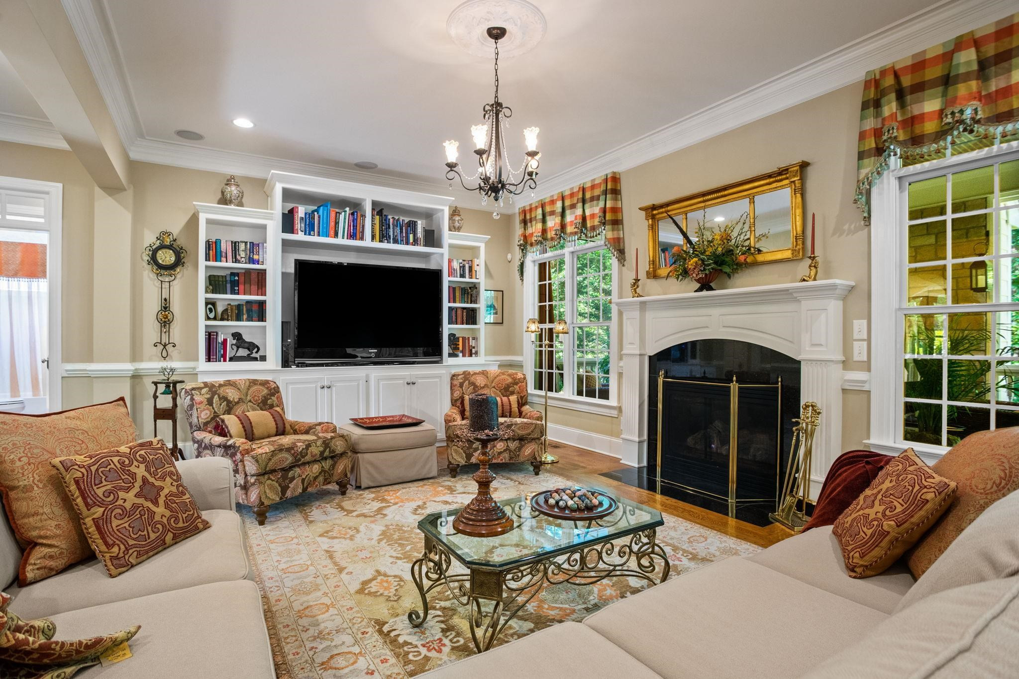 3223 Rain Forrest Way Raleigh, NC 27614 - Photo 14 of 71 a living room with furniture a flat screen tv and a fireplace