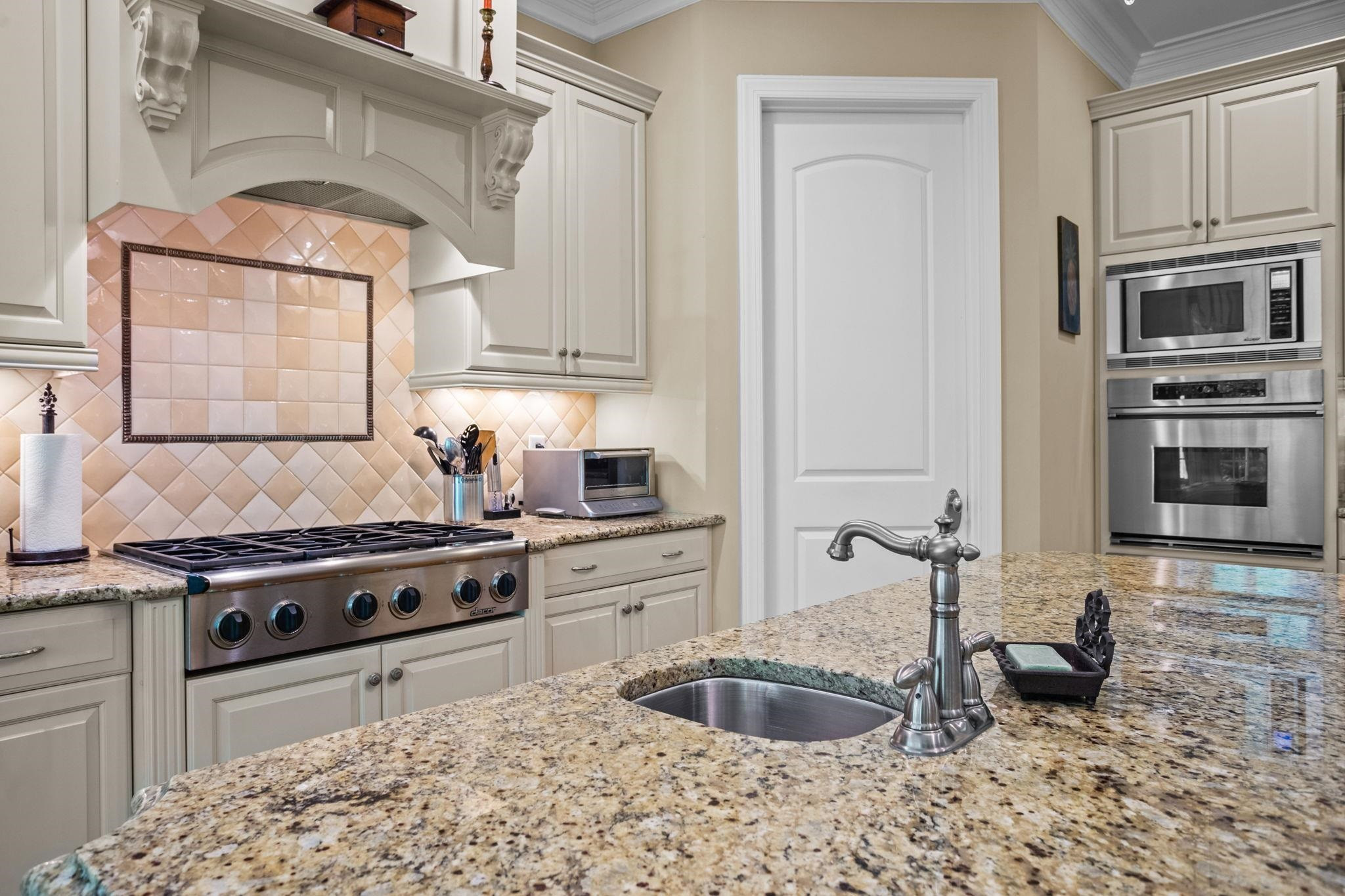 3223 Rain Forrest Way Raleigh, NC 27614 - Photo 20 of 71 a kitchen with stainless steel appliances granite countertop a stove a sink and a microwave