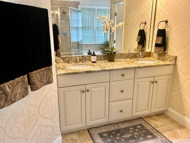 3223 Rain Forrest Way Raleigh, NC 27614 - Photo 27 of 71 a bathroom with a sink and a mirror