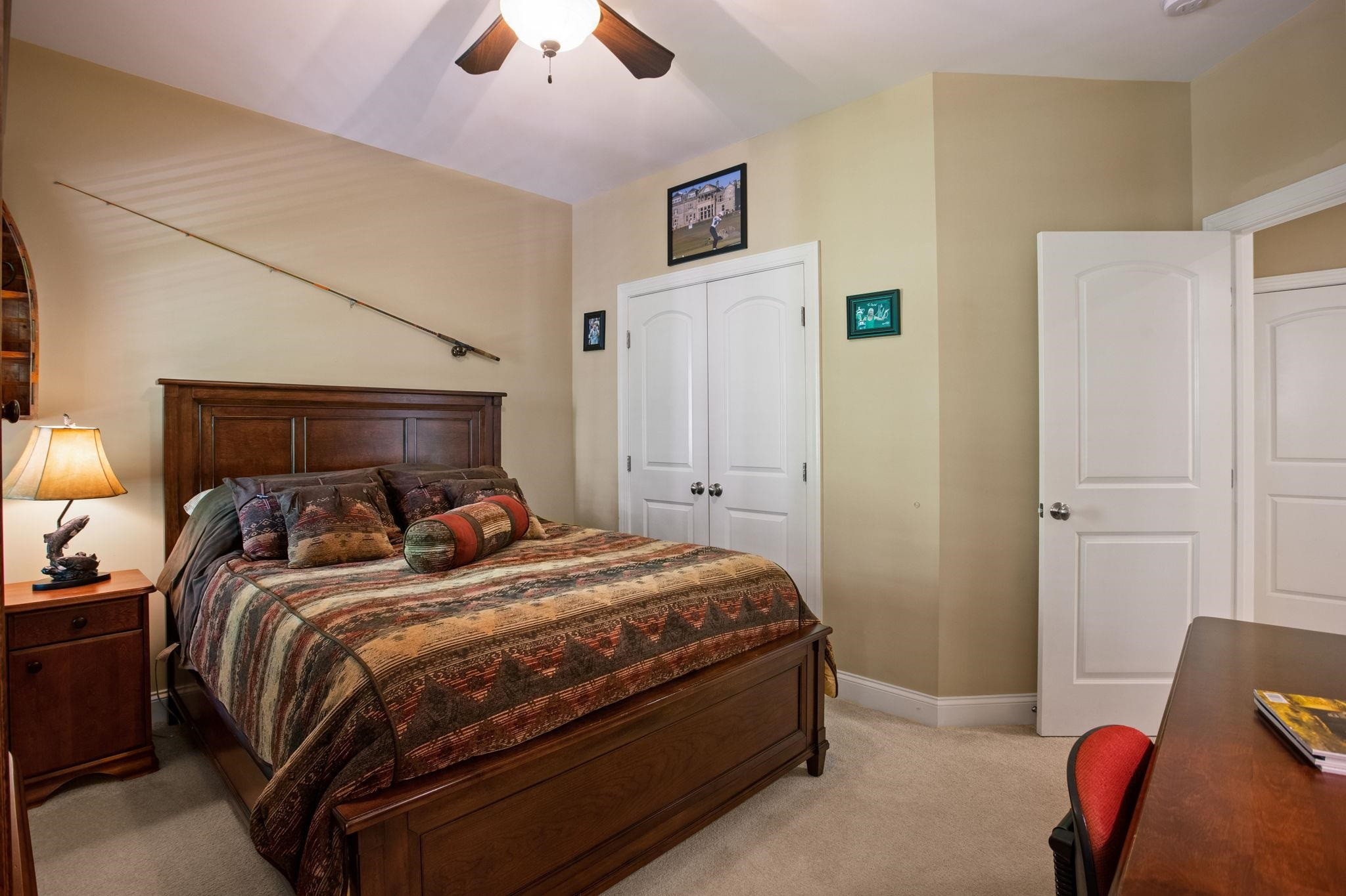 3223 Rain Forrest Way Raleigh, NC 27614 - Photo 34 of 71 a bedroom with a bed and a chandelier