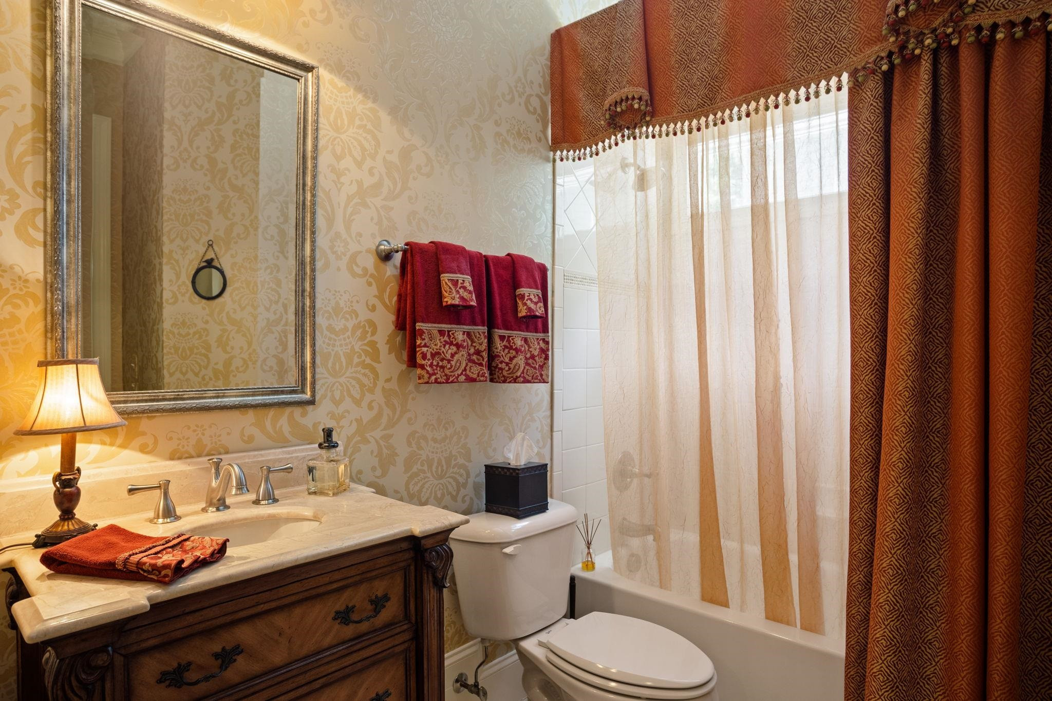 3223 Rain Forrest Way Raleigh, NC 27614 - Photo 36 of 71 a bathroom with a sink a toilet and shower curtain
