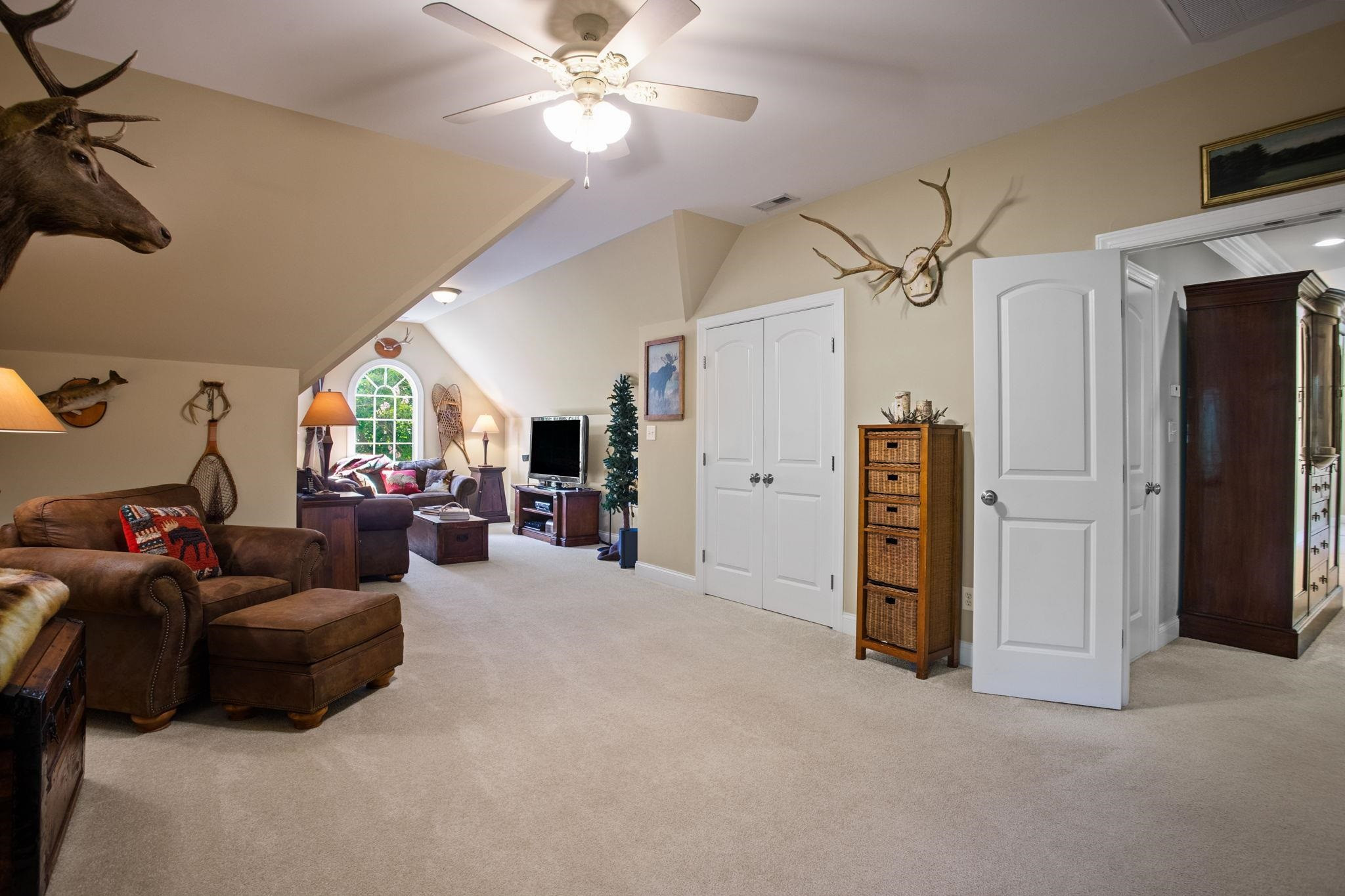 3223 Rain Forrest Way Raleigh, NC 27614 - Photo 41 of 71 a living room with furniture and a chandelier