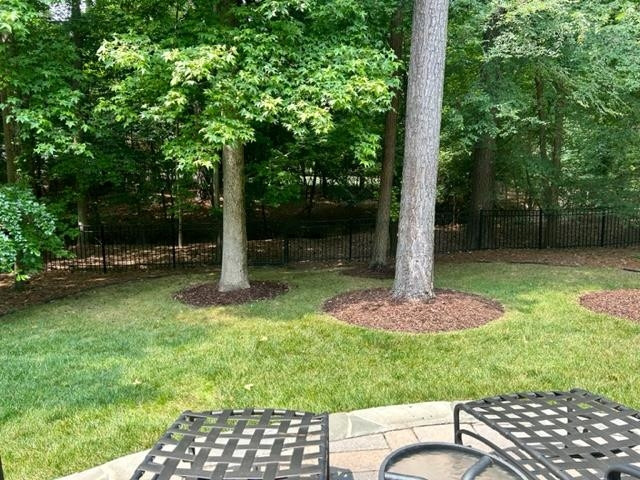 3223 Rain Forrest Way Raleigh, NC 27614 - Photo 49 of 71 a backyard of a house with lots of green space