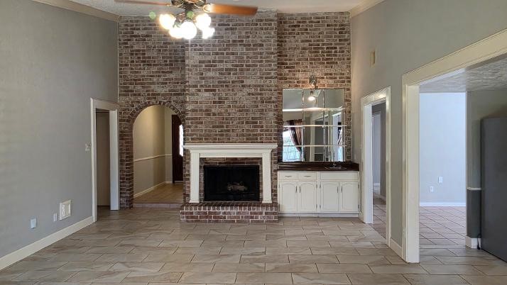 15122 Cedar Ridge Drive Houston, TX 77082 - Photo 7 of 17 Living room Fireplace and Wet bar