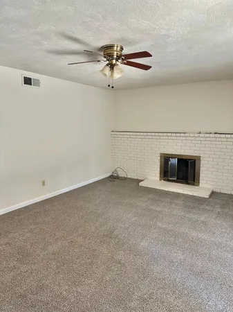 a view of empty room with fan